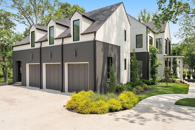 6120 Bresslyn Rd, Nashville, TN 37205 - view of property exterior featuring a shingled roof, driveway, and an attached garage
