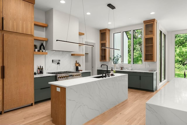 6120 Bresslyn Rd, Nashville, TN 37205 - kitchen featuring open shelves, light wood finished floors, tasteful backsplash, modern cabinets, and an island with sink