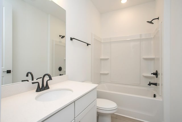 bathroom with wood finished floors, vanity, toilet, bathing tub / shower combination, and recessed lighting