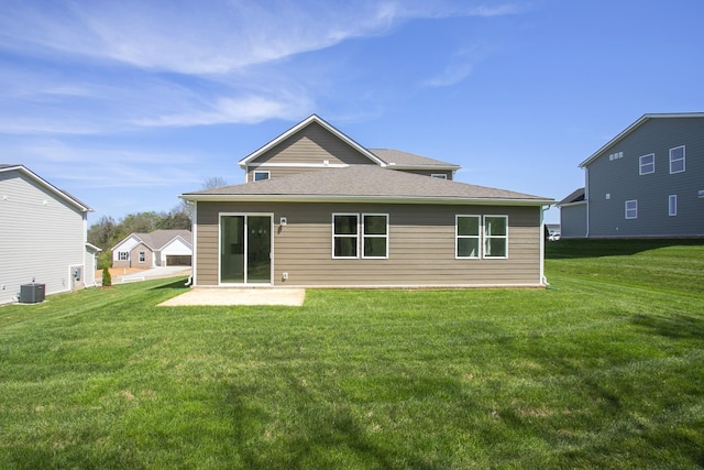 back of house featuring a yard, a patio, and central AC unit