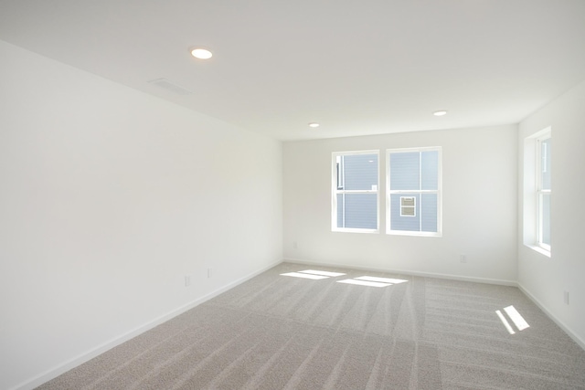 unfurnished room featuring carpet floors, recessed lighting, and baseboards