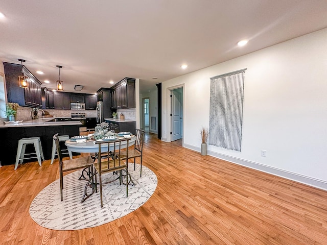 116 Smith Cir, Loretto, TN 38469 - dining room with light wood finished floors, recessed lighting, and baseboards