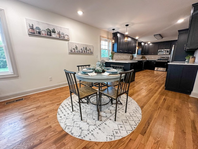 116 Smith Cir, Loretto, TN 38469 - dining room with light wood-style flooring, baseboards, and recessed lighting