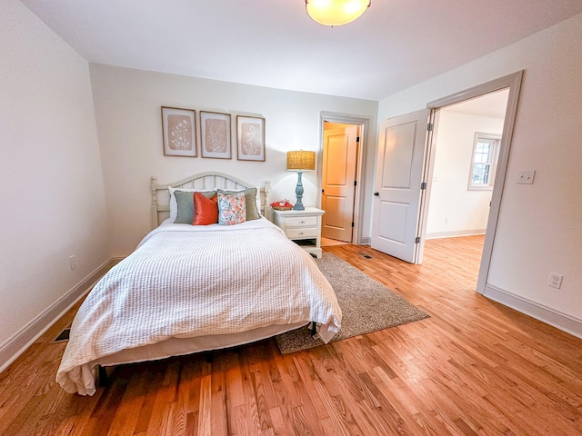 116 Smith Cir, Loretto, TN 38469 - bedroom featuring baseboards and wood finished floors