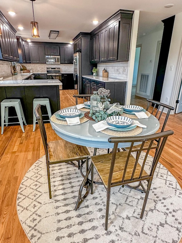 116 Smith Cir, Loretto, TN 38469 - dining room with light wood finished floors
