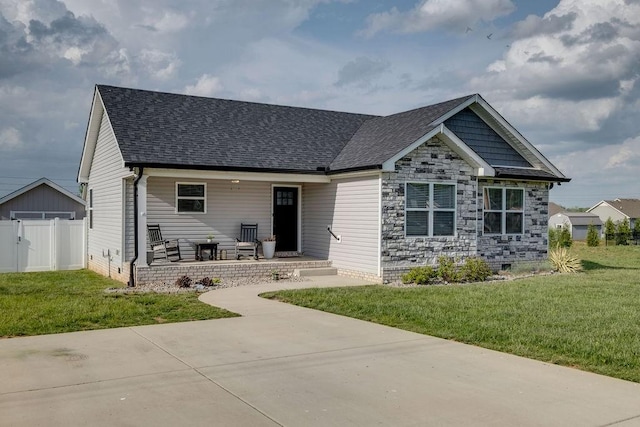 111 Thacker Dr, Portland, TN 37148 - view of front of home featuring a shingled roof, fence, covered porch, and a front yard
