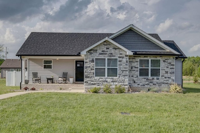 111 Thacker Dr, Portland, TN 37148 - craftsman-style house with roof with shingles, covered porch, stone siding, and a front yard