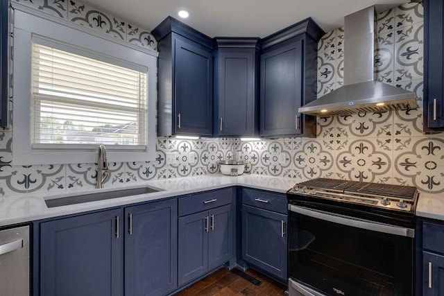 111 Thacker Dr, Portland, TN 37148 - kitchen with a sink, range with gas cooktop, blue cabinetry, and wall chimney exhaust hood