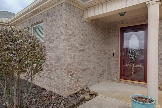 property entrance with brick siding