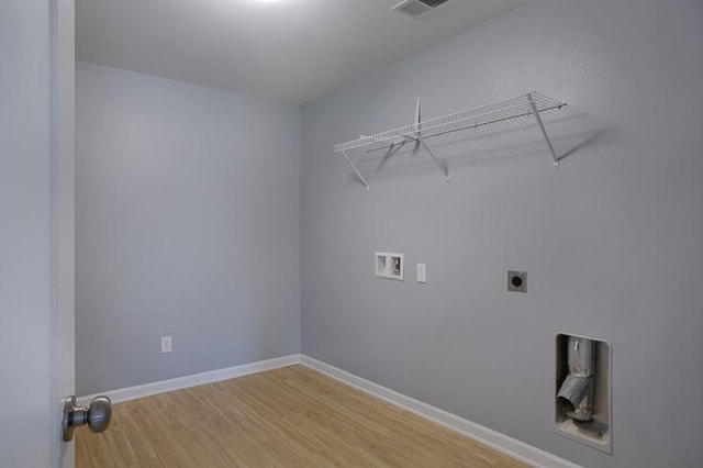 laundry room with laundry area, baseboards, light wood-type flooring, washer hookup, and hookup for an electric dryer