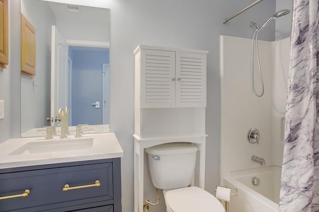 bathroom featuring vanity, toilet, visible vents, and shower / bath combo with shower curtain