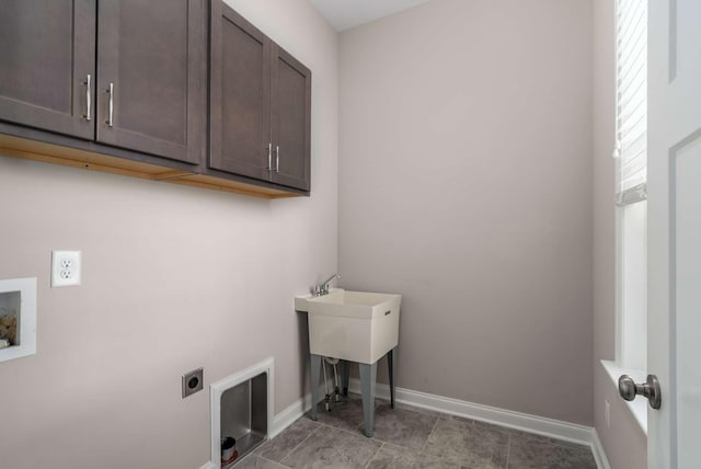laundry area with cabinet space, hookup for an electric dryer, baseboards, and washer hookup