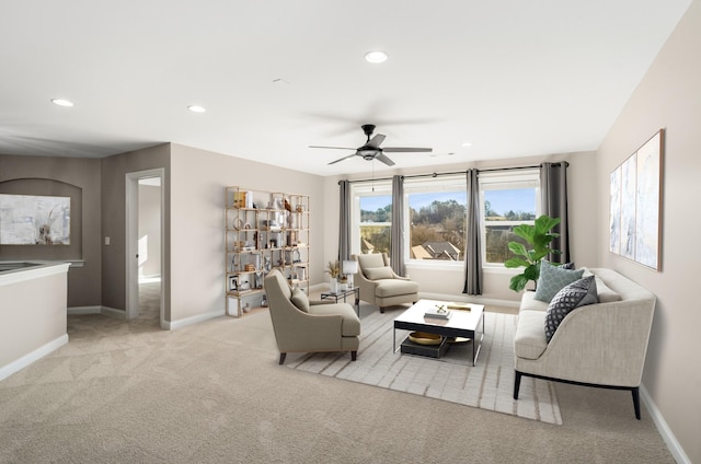 living area with carpet floors, recessed lighting, ceiling fan, and baseboards