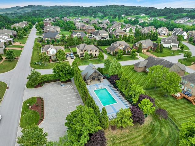 birds eye view of property with a residential view