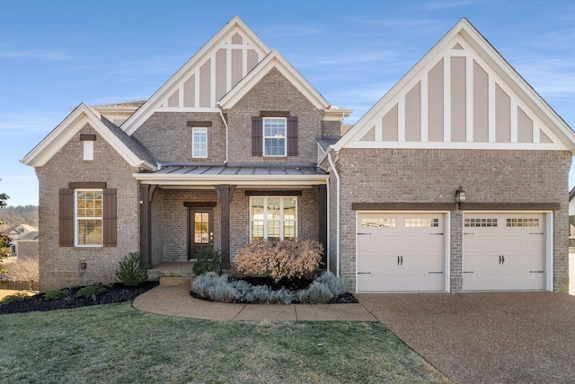 view of front of home featuring a garage, a standing seam roof, brick siding, a porch, and driveway