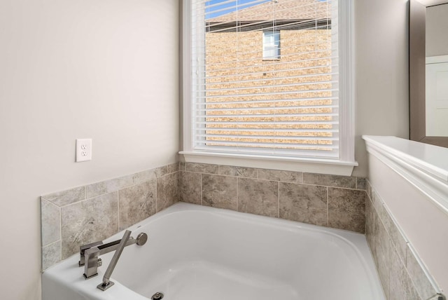 bathroom with a bath and a wealth of natural light