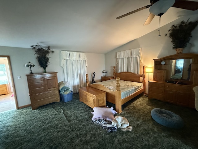bedroom featuring carpet floors, a ceiling fan, and lofted ceiling