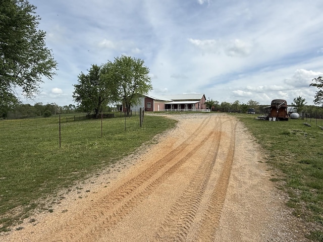 view of street featuring driveway and a rural view