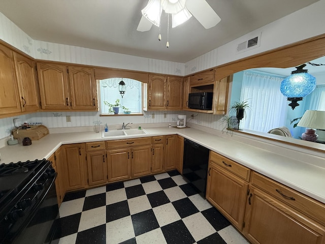 kitchen with ceiling fan, visible vents, a sink, black appliances, and light floors