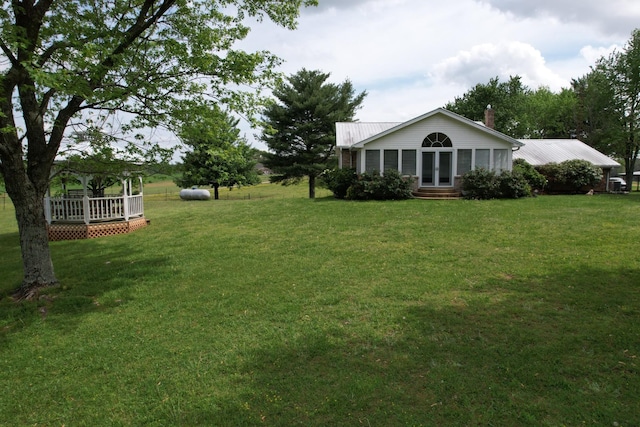 view of yard featuring entry steps and a gazebo