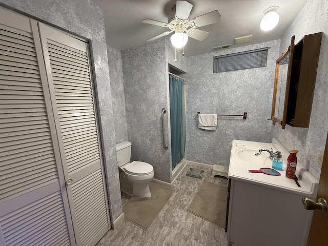 full bathroom with vanity, toilet, a shower with curtain, visible vents, and a closet