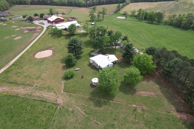 birds eye view of property with a rural view