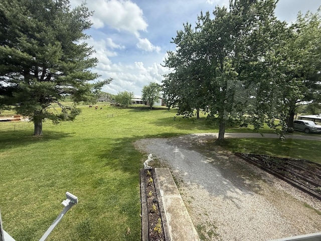 surrounding community featuring a lawn