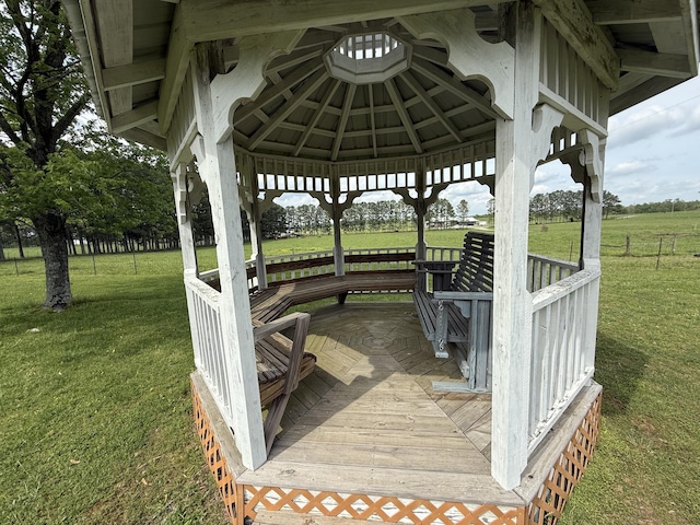 deck featuring a gazebo and a lawn