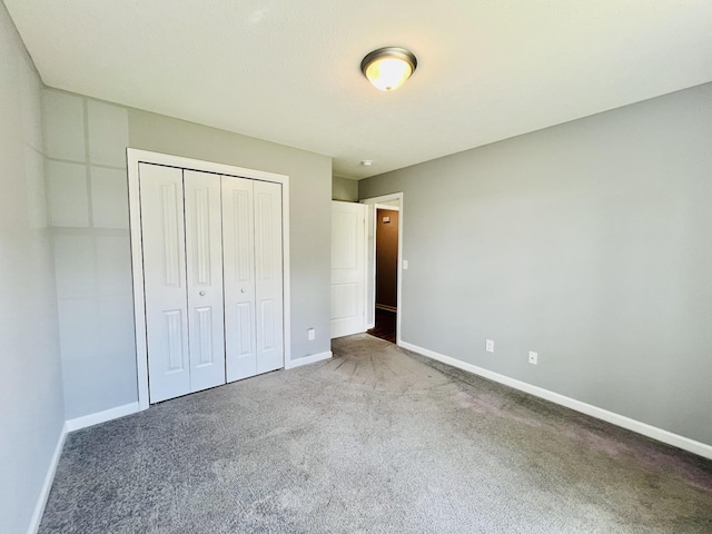 436 White Rd, Leoma, TN 38468 - unfurnished bedroom with carpet floors, baseboards, and a closet