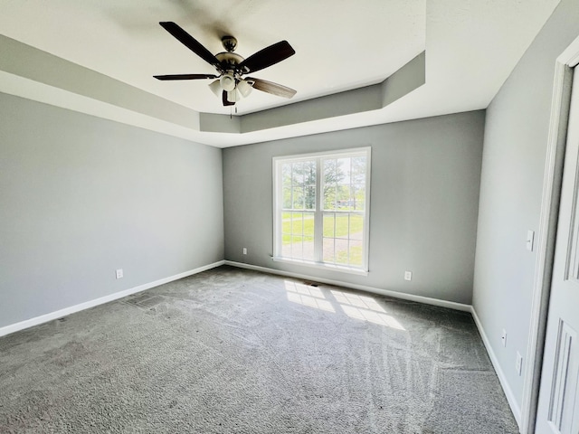436 White Rd, Leoma, TN 38468 - carpeted spare room with baseboards, ceiling fan, and a raised ceiling