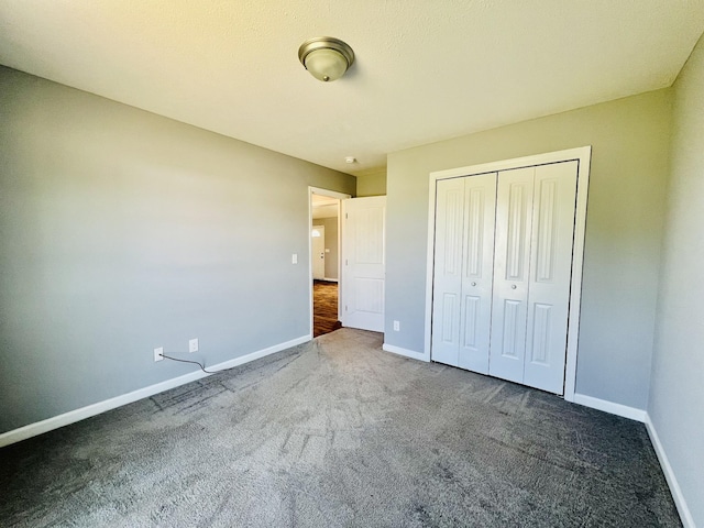 436 White Rd, Leoma, TN 38468 - unfurnished bedroom with a closet, baseboards, and carpet flooring
