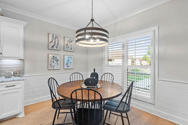 1209 Janie Sue Ct, Lebanon, TN 37087 - dining area featuring a chandelier, light wood-type flooring, crown molding, a wainscoted wall, and baseboards