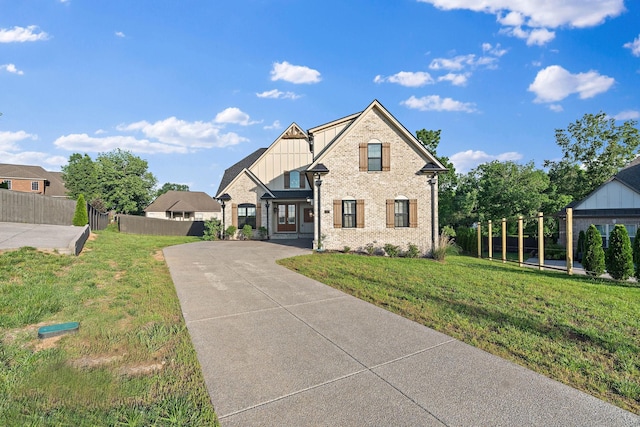 1209 Janie Sue Ct, Lebanon, TN 37087 - view of front facade with board and batten siding, brick siding, and driveway