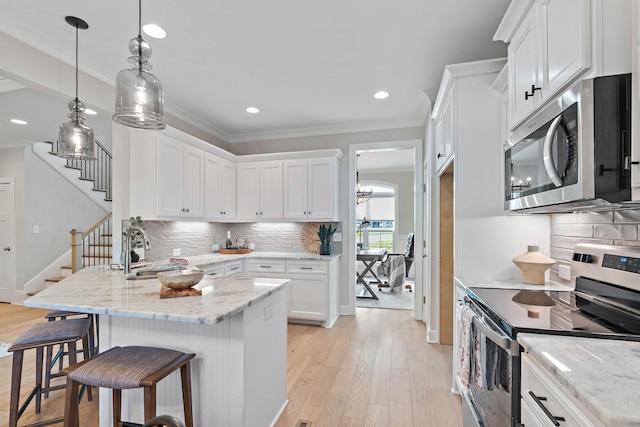 1209 Janie Sue Ct, Lebanon, TN 37087 - kitchen with stainless steel appliances, a sink, white cabinetry, crown molding, and recessed lighting