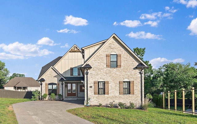 1209 Janie Sue Ct, Lebanon, TN 37087 - view of front facade featuring board and batten siding, brick siding, concrete driveway, and french doors