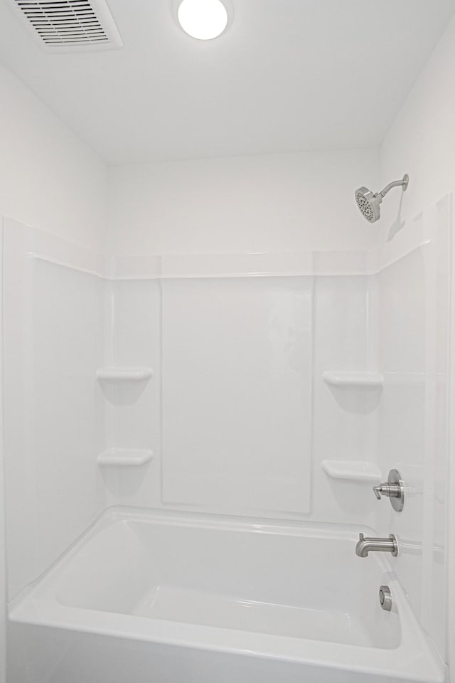 full bath featuring bathtub / shower combination and visible vents