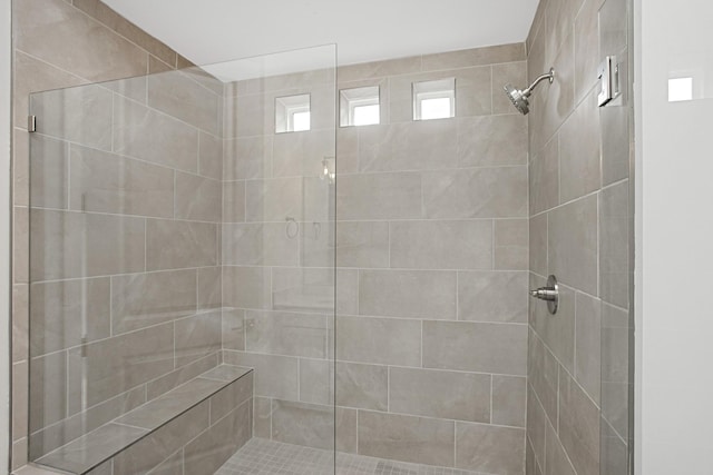 bathroom featuring a tile shower