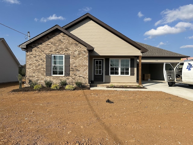 508 Dorsch Rd, Manchester, TN 37355 - view of front of house with concrete driveway, brick siding, and an attached garage