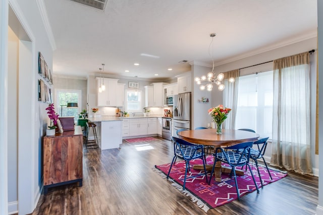 dining area with visible vents, ornamental molding, and dark wood-style floors