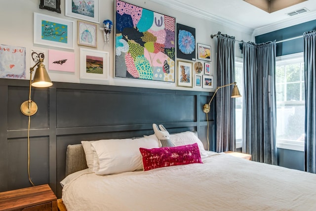 bedroom with visible vents and ornamental molding