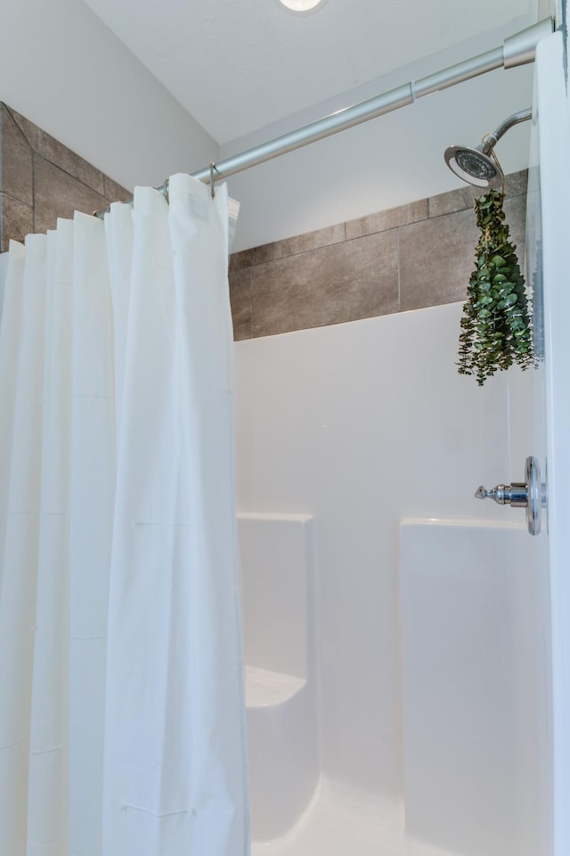 bathroom with a shower with shower curtain