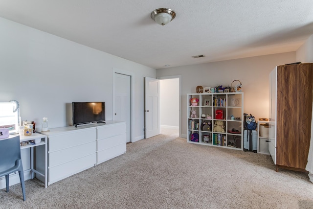 interior space with visible vents and carpet