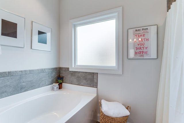 full bathroom with a bath