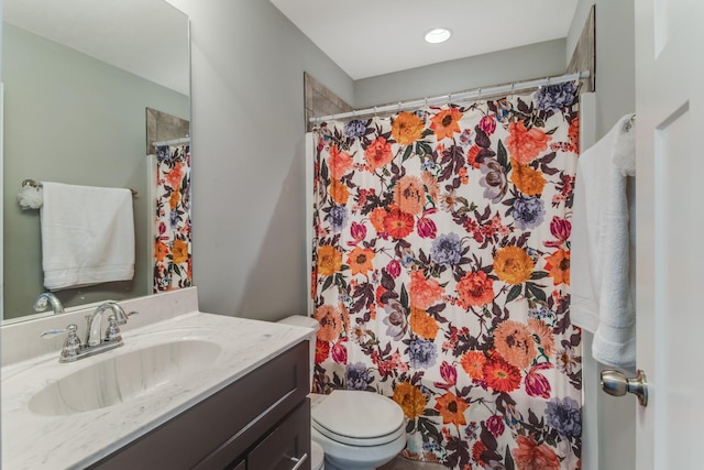 bathroom with vanity, a shower with curtain, and toilet