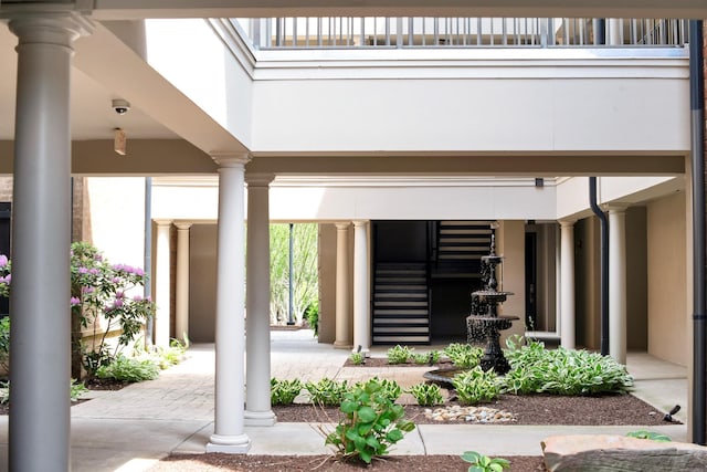exterior space featuring stucco siding and a balcony