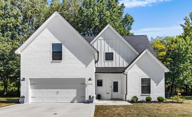 modern inspired farmhouse with roof with shingles, brick siding, board and batten siding, concrete driveway, and an attached garage