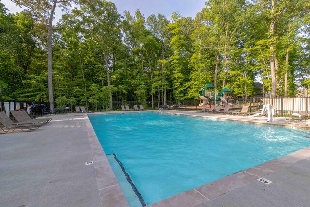 pool featuring fence and playground community