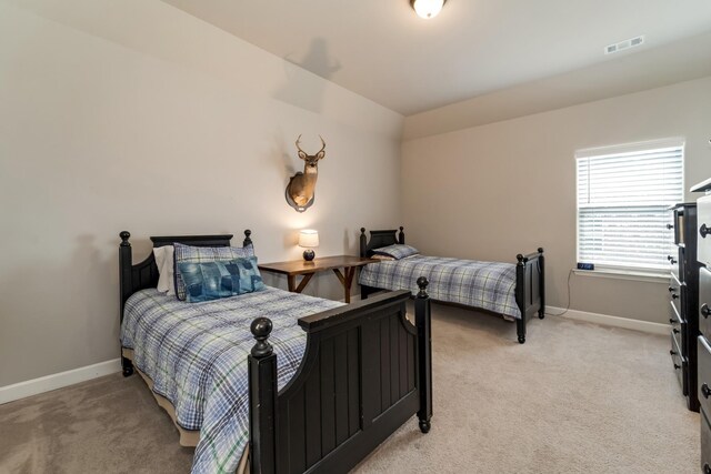 6006 Trotwood Ln, Spring Hill, TN 37174 - bedroom featuring visible vents, baseboards, and light colored carpet