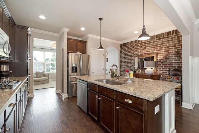 6006 Trotwood Ln, Spring Hill, TN 37174 - kitchen featuring arched walkways, appliances with stainless steel finishes, dark wood finished floors, dark brown cabinets, and a sink