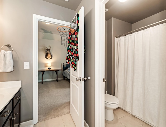6006 Trotwood Ln, Spring Hill, TN 37174 - full bath featuring tile patterned floors, baseboards, vanity, and toilet